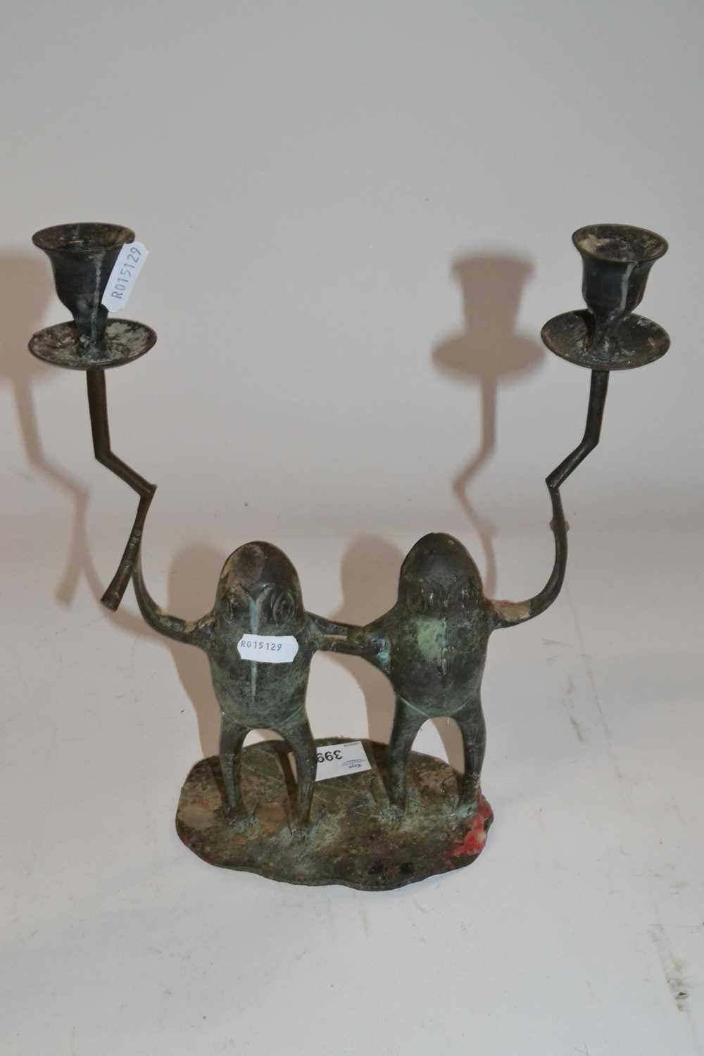 A metal candle holder shaped as two frogs, each holding a candle sconce on oval metal base - Image 2 of 2