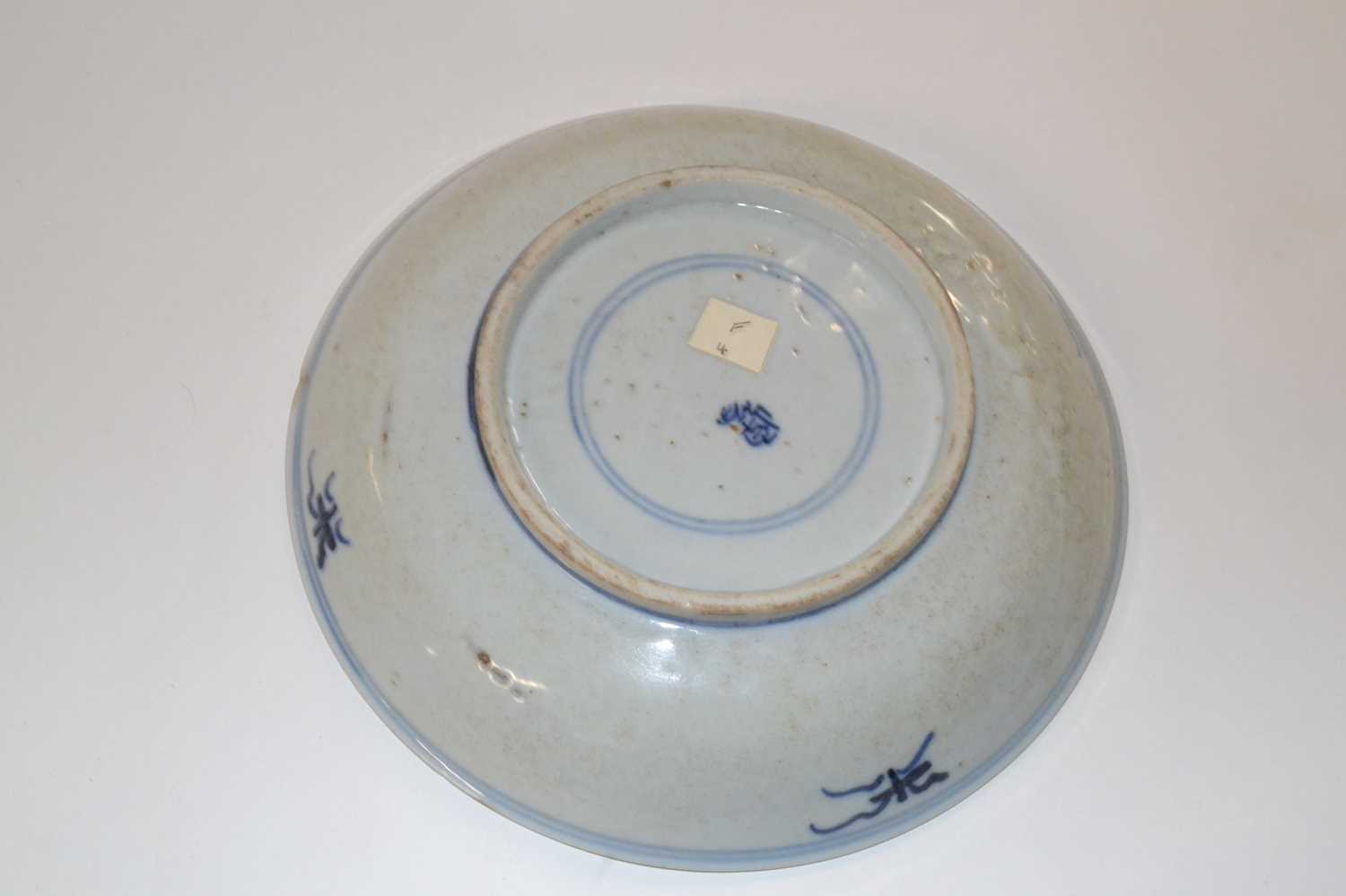 A Chinese porcelain bowl, the centre designed in blue with a stork surrounded by Buddhist symbols, - Image 2 of 4