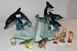 A pair of glass Art Deco style book ends, two Poole pottery models of dolphins and a quantity of
