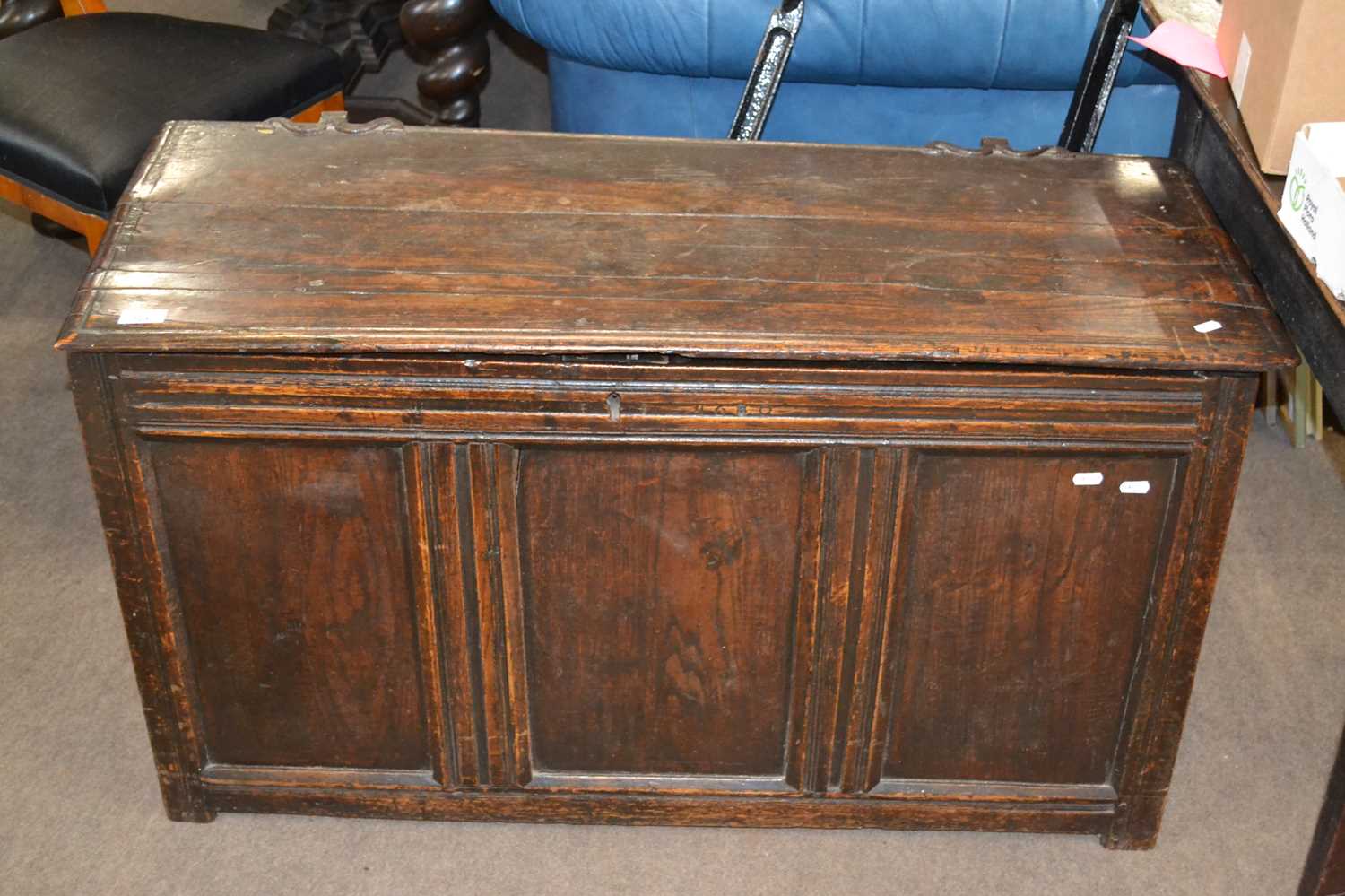 An 18th Century oak coffer with three panelled front, 108cm wide