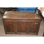 An 18th Century oak coffer with three panelled front, 108cm wide