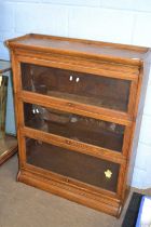 A Globe Wernicke oak three tier stacking bookcase, 87cm wide