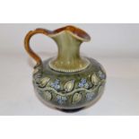 An early 20th Century Royal Doulton ewer with tubelined floral design