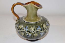 An early 20th Century Royal Doulton ewer with tubelined floral design