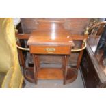 A late Victorian oak and brass mounted stick stand with central drawer, 100cm wide