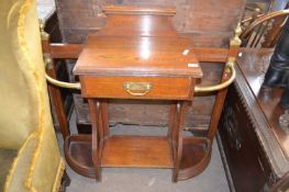 A late Victorian oak and brass mounted stick stand with central drawer, 100cm wide