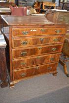 An unusual Georgian yew secretaire chest with fitted secretaire drawer with drop down front