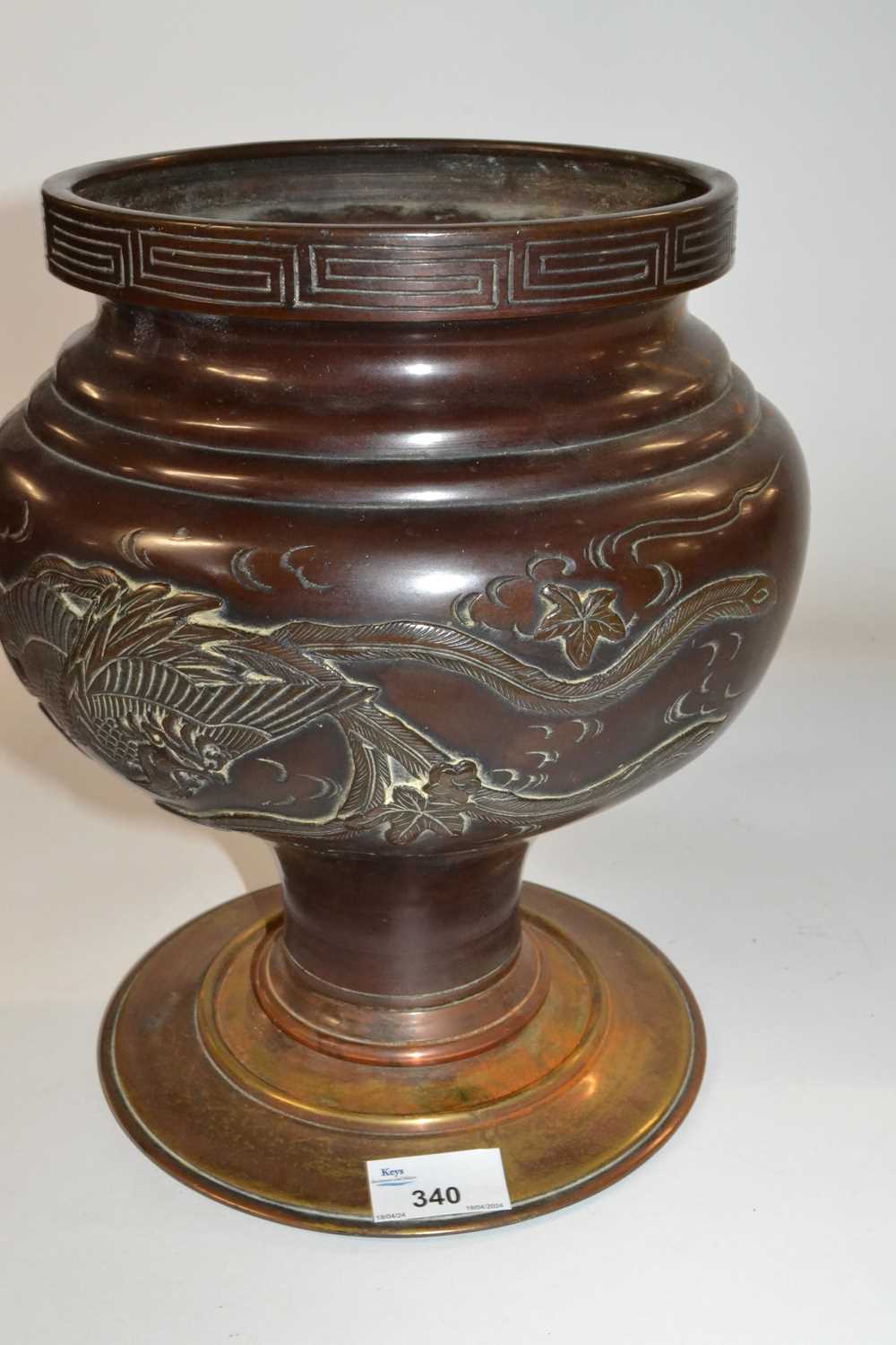 A Japanese bronze vase and stand with raised decoration of flowers and dragons, Meiji period, 30cm
