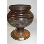 A Japanese bronze vase and stand with raised decoration of flowers and dragons, Meiji period, 30cm