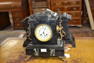 A late 19th Century black slate and marble mounted mantel clock of typical form, 29cm high