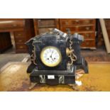 A late 19th Century black slate and marble mounted mantel clock of typical form, 29cm high
