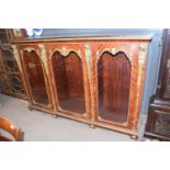 A large 20th Century mahogany veneered and metal mounted bookcase or display cabinet in the French