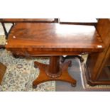 A Victorian flame mahogany veneered card table with folding and rotating baize lined top over an