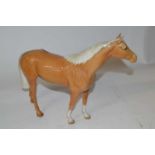 A Beswick model of a Palomino mare in a gloss finish by Arthur Gredington (1961-1983)