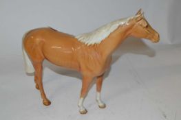 A Beswick model of a Palomino mare in a gloss finish by Arthur Gredington (1961-1983)