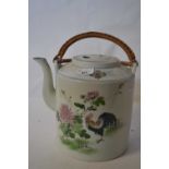 A large Chinese porcelain kettle painted with a cockerel and floral sprays with wicker handle