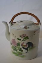 A large Chinese porcelain kettle painted with a cockerel and floral sprays with wicker handle