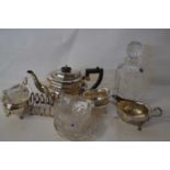 A silver plated tea set and toast rack together with a Royal Doulton crystal glass decanter and