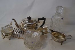 A silver plated tea set and toast rack together with a Royal Doulton crystal glass decanter and