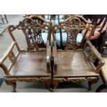 A pair of Chinese hardwood chairs with pierced floral decorated backs, 91cm