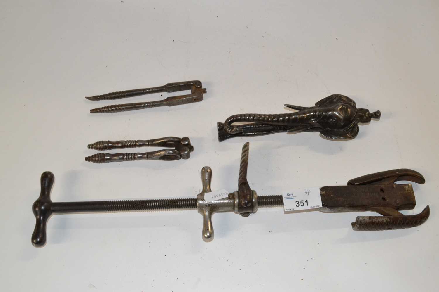 Group lot of metal wares comprising a sole makers tool together with a novelty elephant head nut