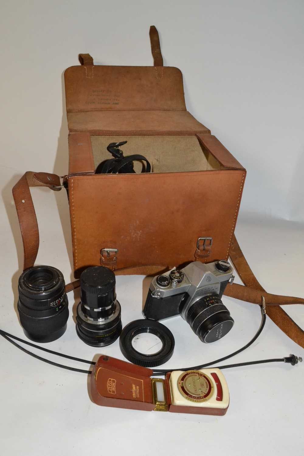 Box containing a quantity of camera equipment including a Asahi Pentax camera with accessories