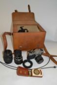 Box containing a quantity of camera equipment including a Asahi Pentax camera with accessories
