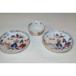 A Lowestoft porcelain tea bowl and saucer in the Dolls House pattern together with a further
