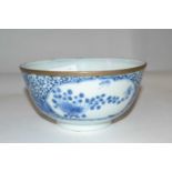 A Chinese porcelain bowl, 19th Century with blue and white floral design, four character mark to