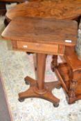 A small early Victorian rosewood pedestal table with tapering column, platform base and turned bun