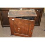 A George III oak wall cabinet with single panelled door and shelved interior, 56cm high