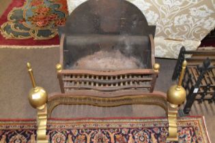 A large cast iron and brass fire basket in the Georgian style, 80cm wide maximum