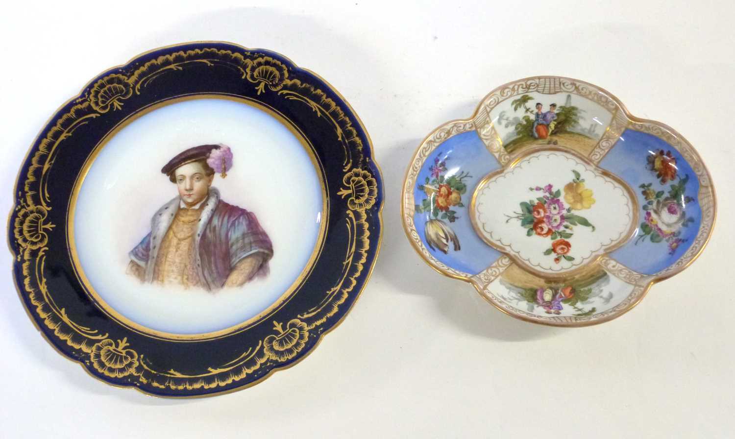 A 19th Century continental porcelain lobed dish decorated in Meissen style with blue AR mark to base