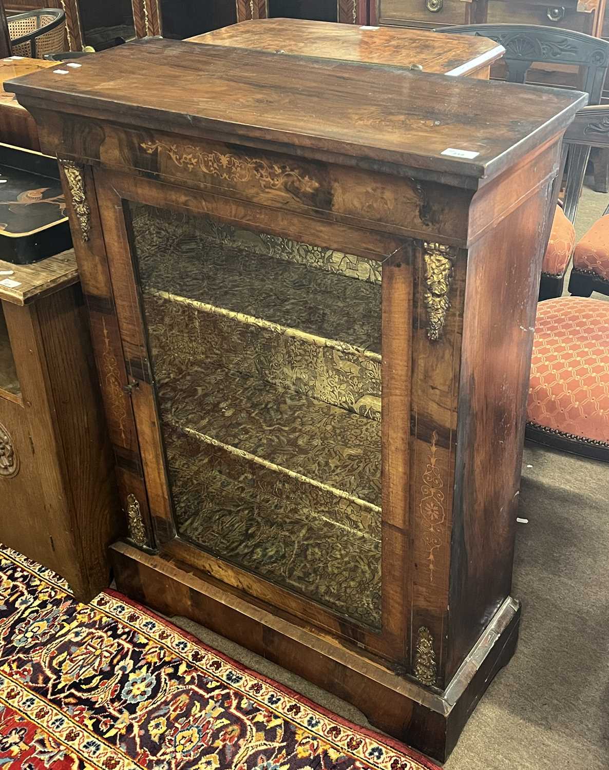 A Victorian walnut veneered pier cabinet of typical form with single glazed door and platform - Image 3 of 3