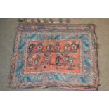 A Belouch saddle bag type wall hanging decorated with red, blue and cream geometric designs, 72cm