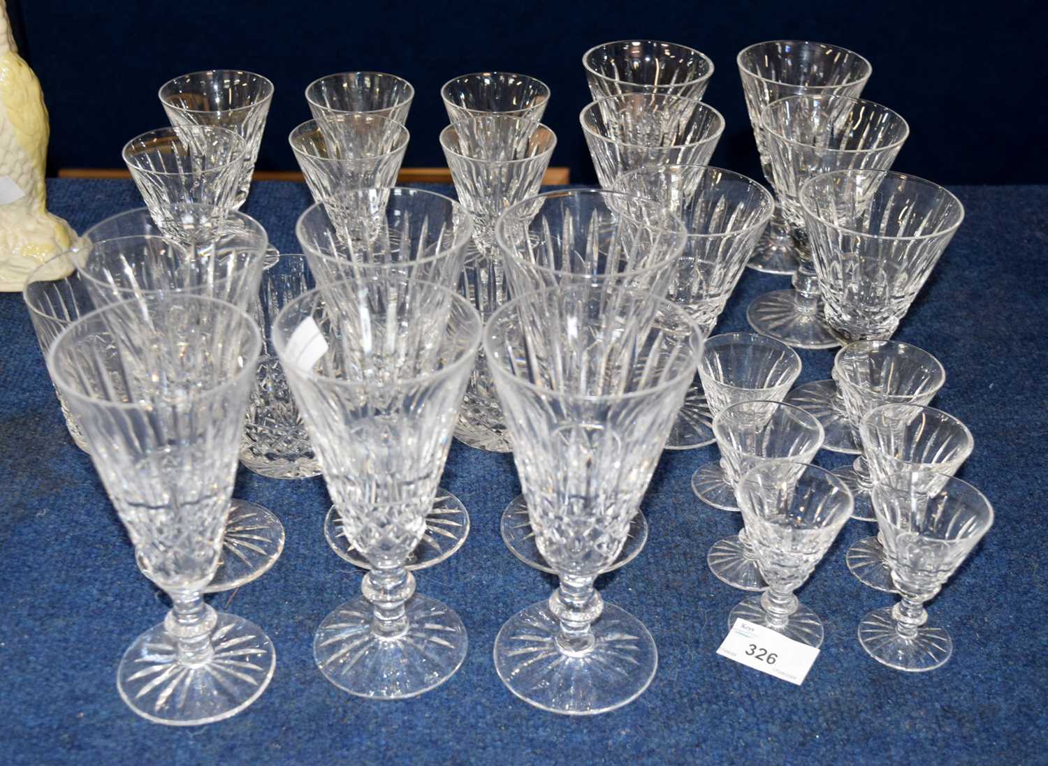 A suite of Waterford glasses including six large wine glasses, six smaller further graduated sets of