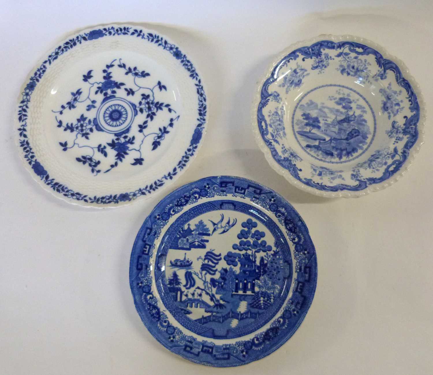 A group of Staffordshire wares including a Chinese marine scene, a Minton blue and white plate and