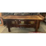 Low Chinese hardwood side table with three drawers, applied carved decoration, 125cm wide