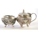 Antique 19th Century Indian silver condiment set featuring mustard pot and salt decorated in cutch