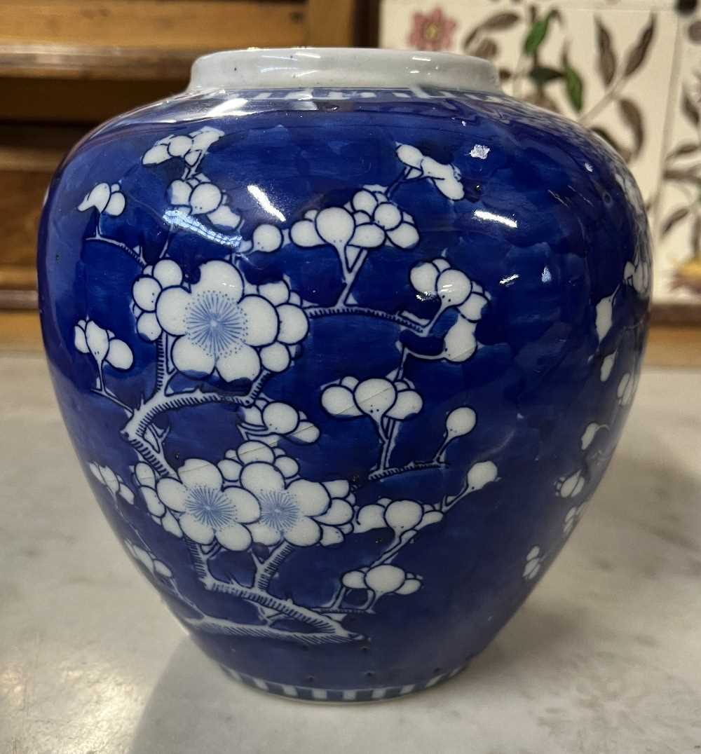 A Chinese porcelain ginger jar 19th Century, the blue ground with prunus decoration, four - Image 10 of 11