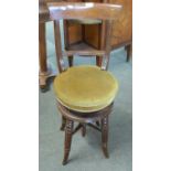 A Victorian revolving high back music chair on fluted legs