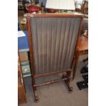 Gillows style mahogany framed fire screen pleated fabric panels and turned central stretcher and
