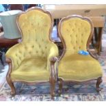 A pair of Victorian ladies and gents button upholstered chairs finished in mustard fabric with