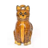 A Slip ware cat with detachable cover/head, made by Carole Glover
