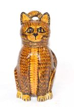 A Slip ware cat with detachable cover/head, made by Carole Glover