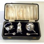 In perfect and unused condition this silver plated three piece cruet in velvet and satin lined