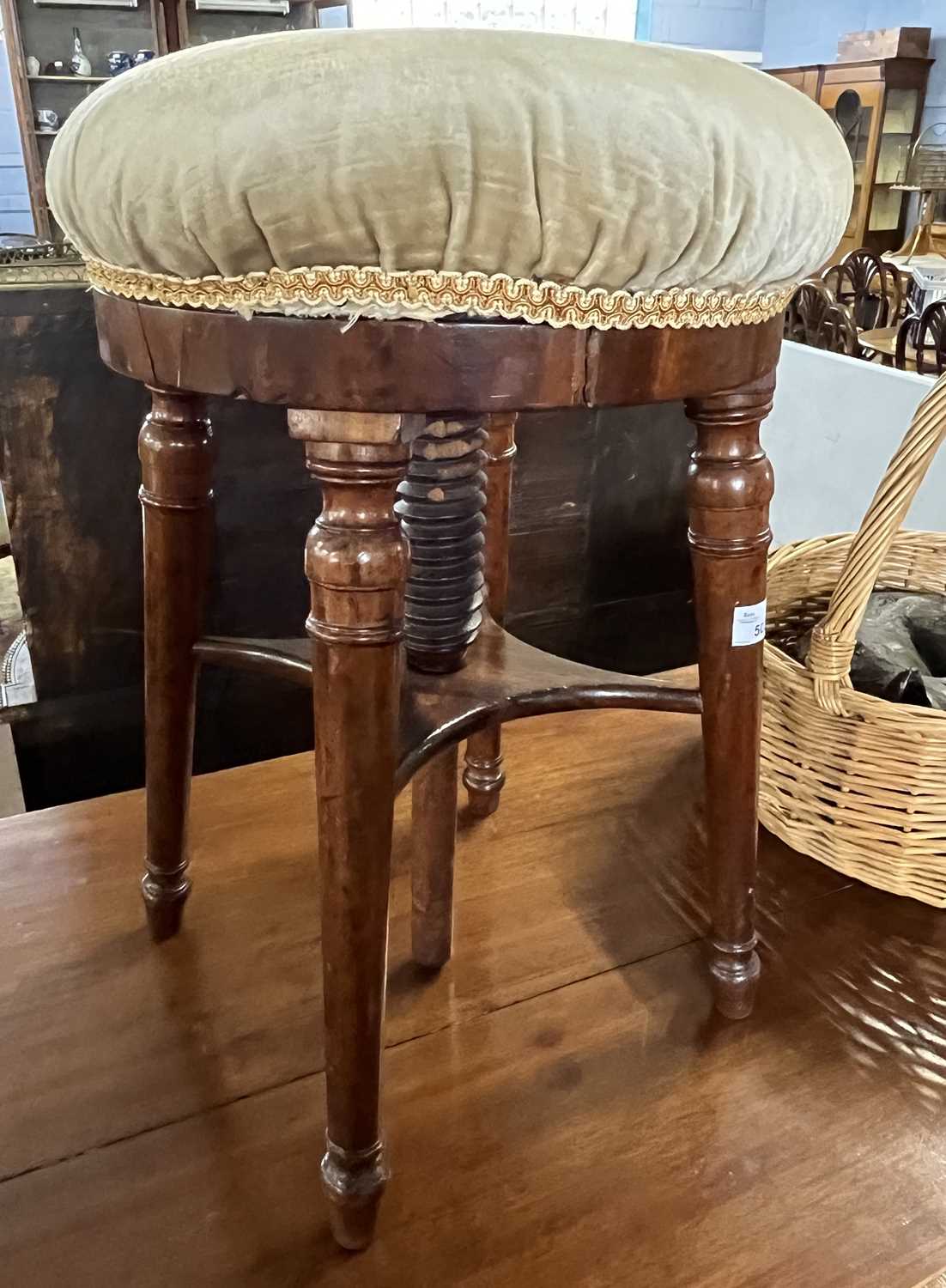 A Victorian circular topped adjustable stool on tapering legs, 50cm high