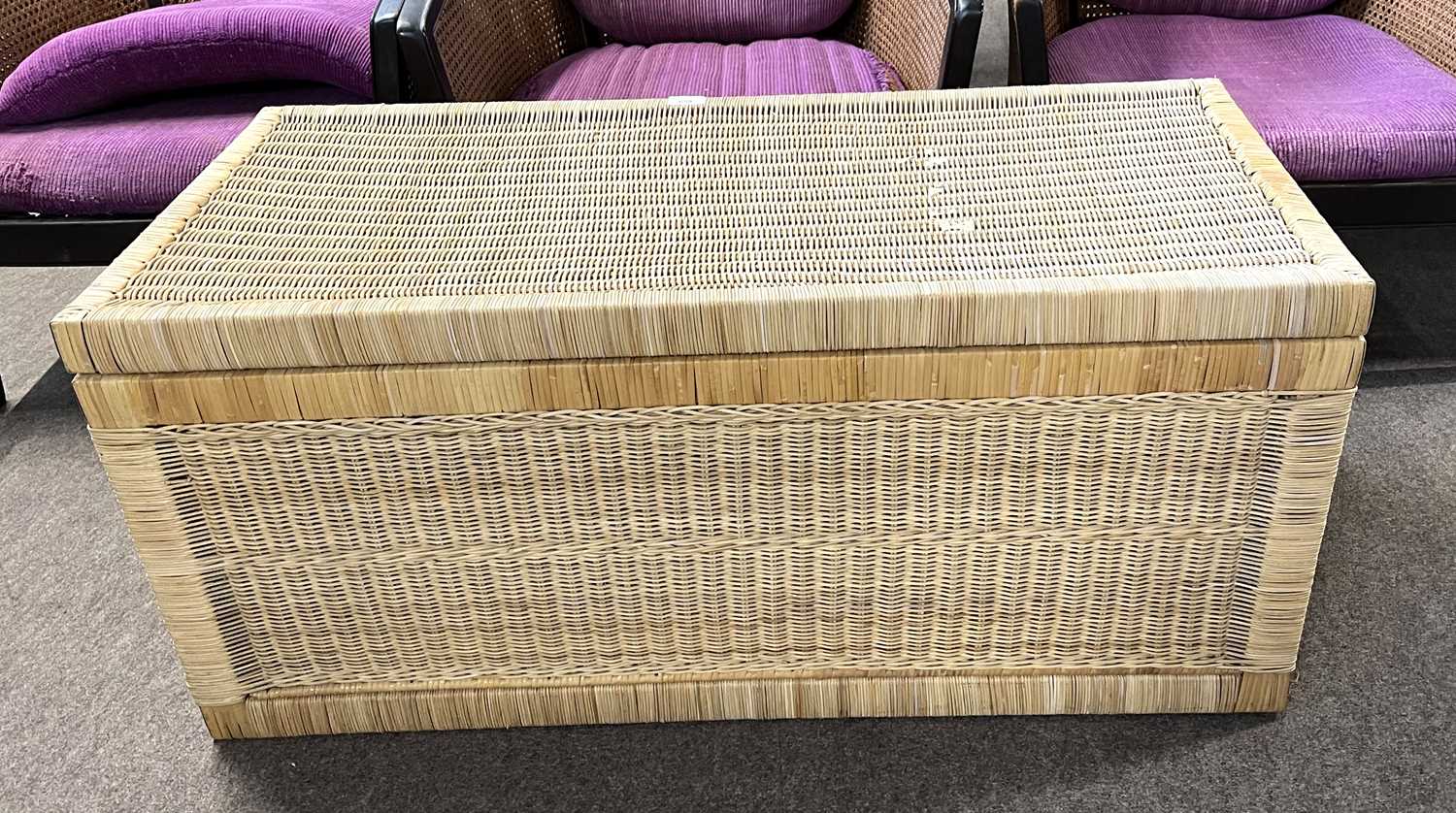 A mid 20th Century wicker blanket chest with brass handles at either end, 101cm long