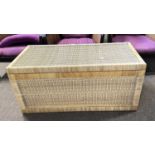 A mid 20th Century wicker blanket chest with brass handles at either end, 101cm long