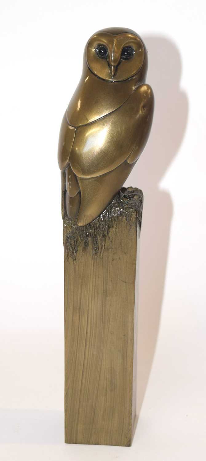 A further ceramic sculpture of an owl on rectangular plinth with a metal finish, signed Oswaldo
